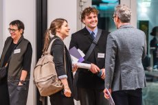 Three people meeting, smiling