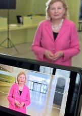 Person being filmed by a camera