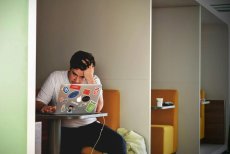 Person at a laptop, frustrated