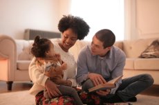 Parents reading to a small child