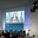 EU Vice president Suica speaking on a screen over a panel of five people