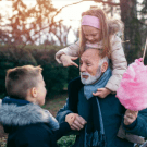 Children and an older man playing together