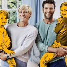 Photo of two people, man and woman, holding two cartoon children 