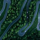 Winding road in a forest area, seen from above