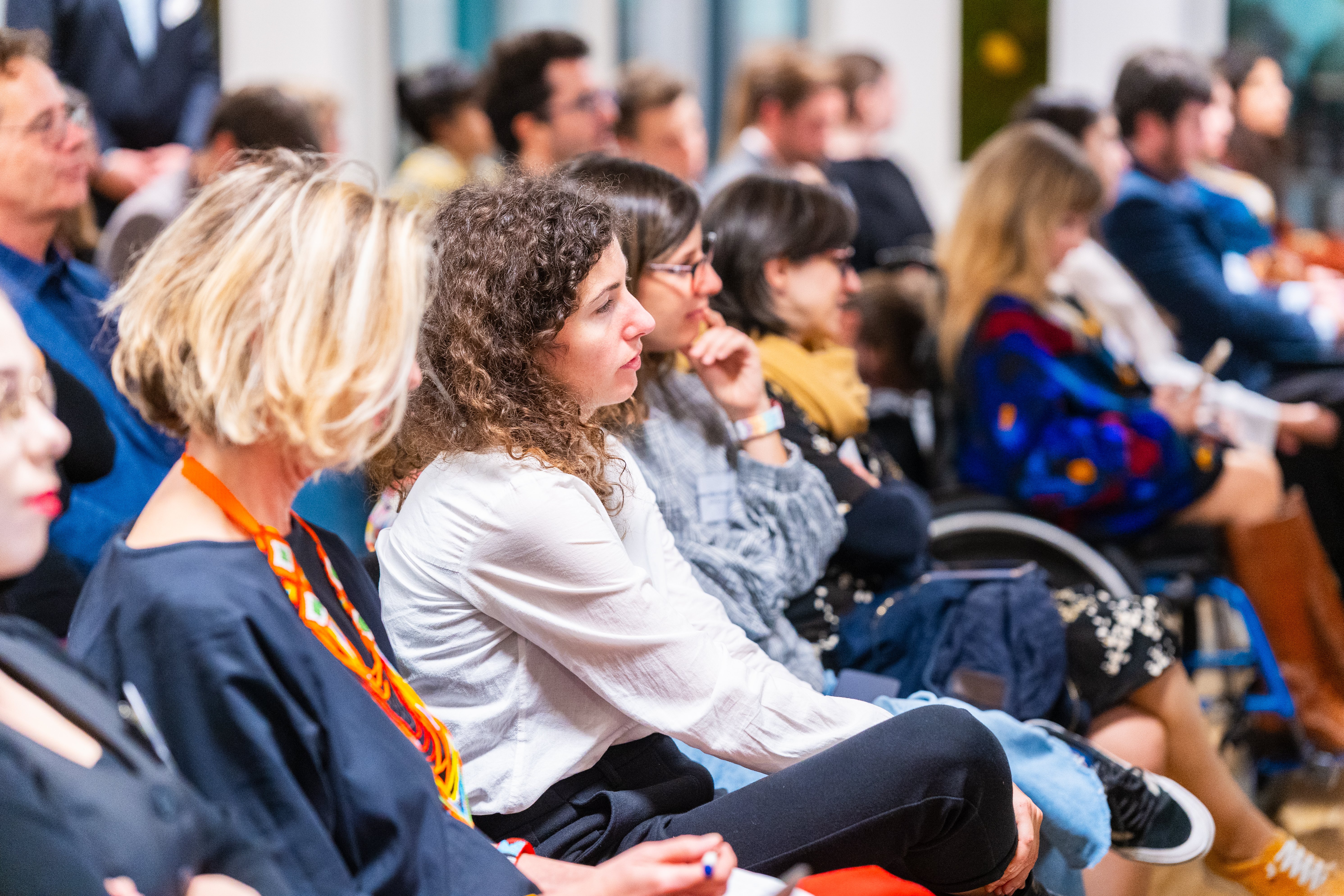 An audience of people listening