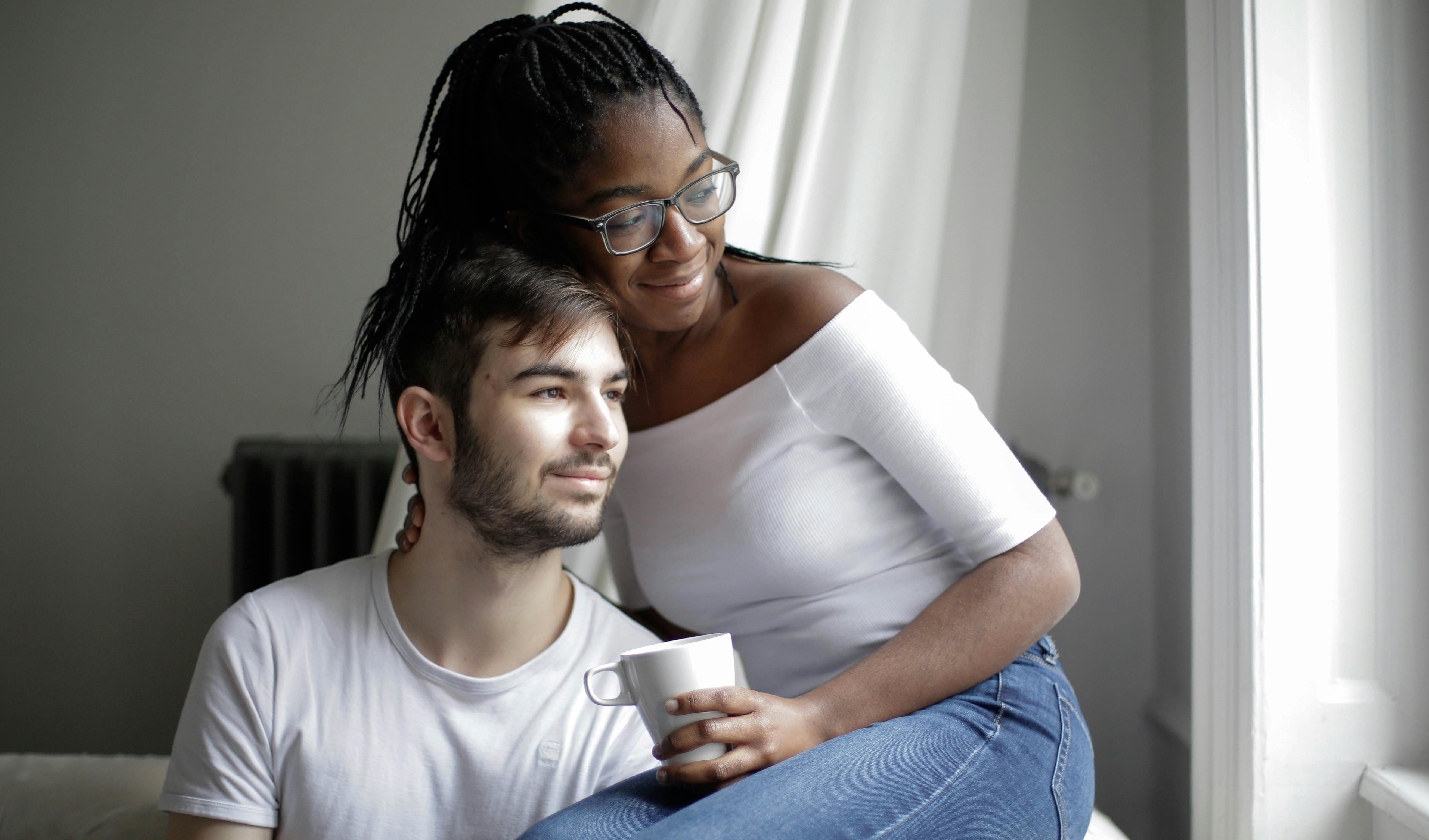 Young couple looking hopeful and content