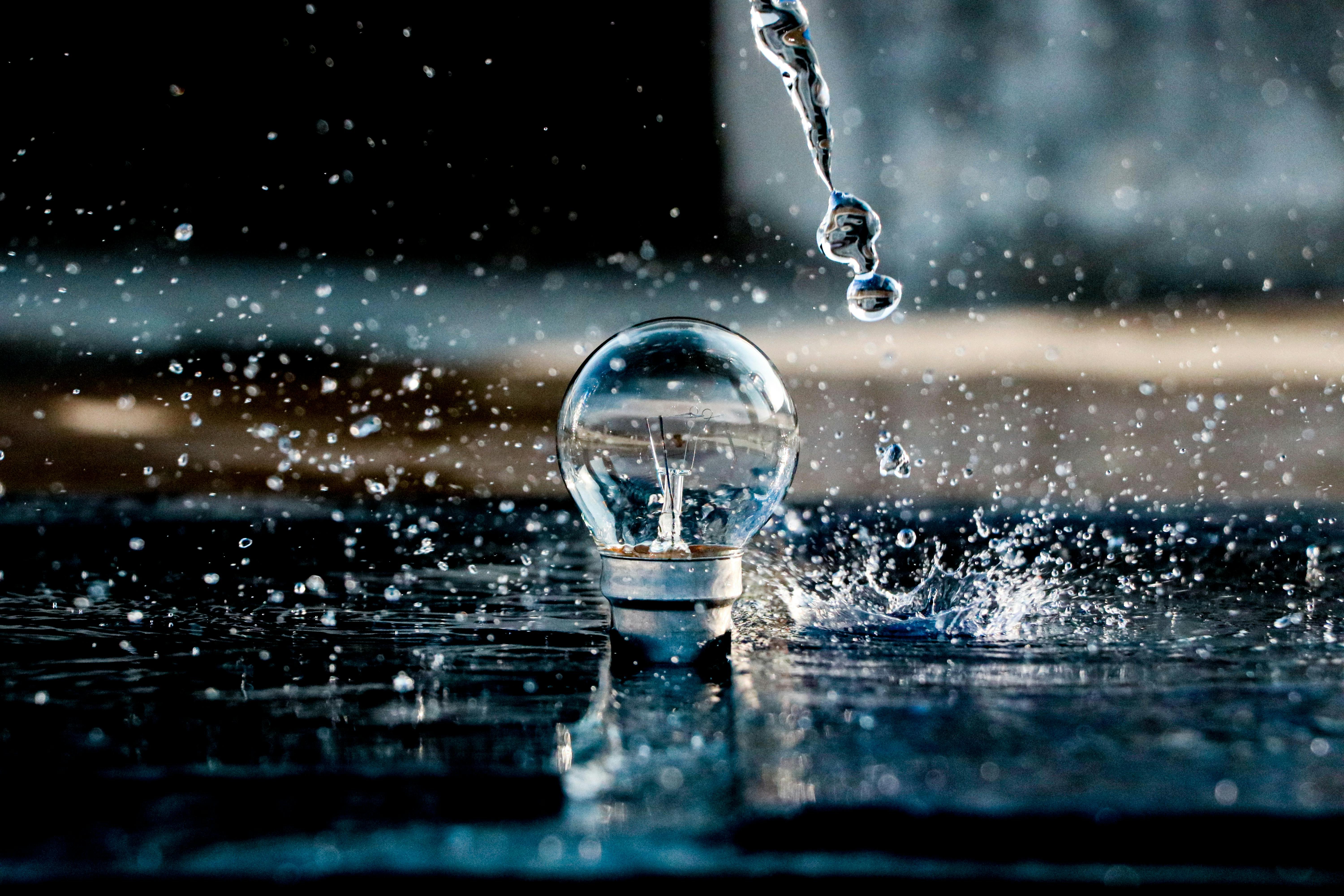 A lightbulb and drops of water