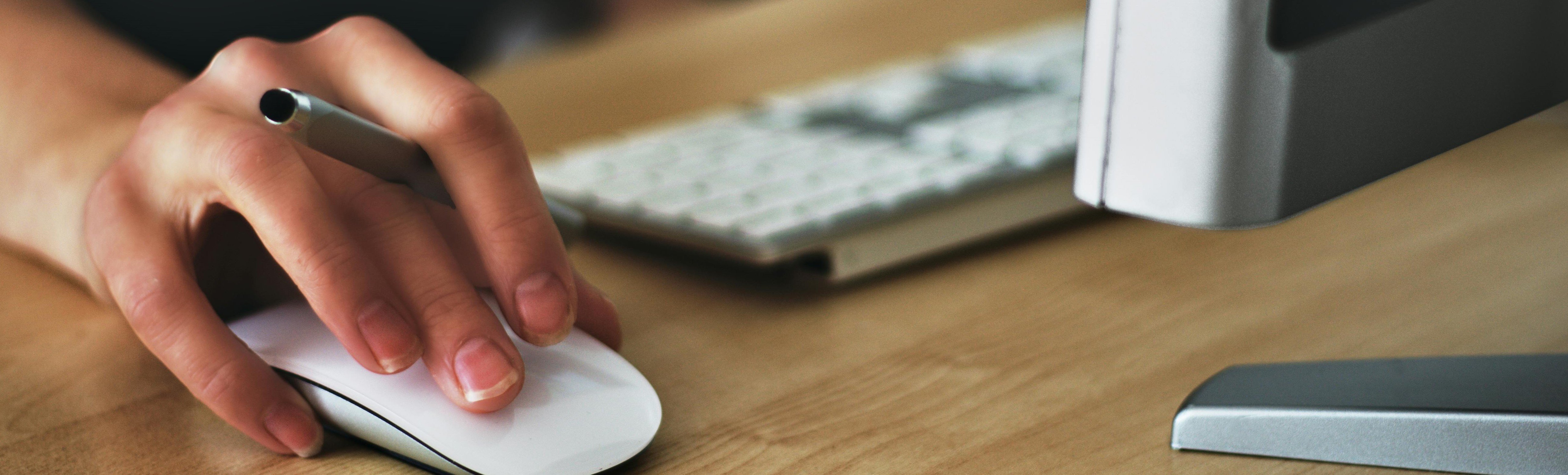 Hand on a computer mouse